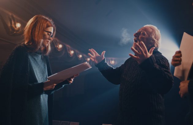 Actor,And,Actress,With,Scripts,Holding,Hands,And,Speaking,With